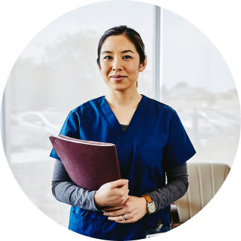 Female Healthcare Professional holding documents
