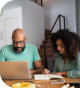 Man and woman working on laptop