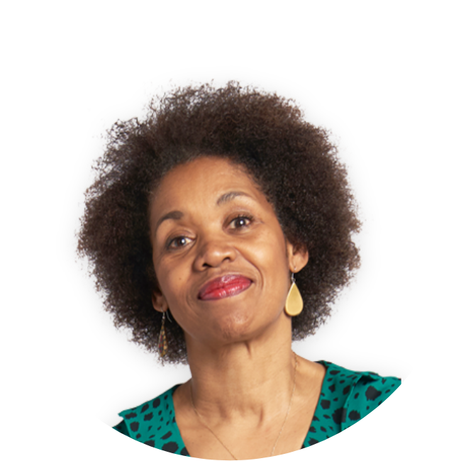 Woman smiling ahead in a green shirt