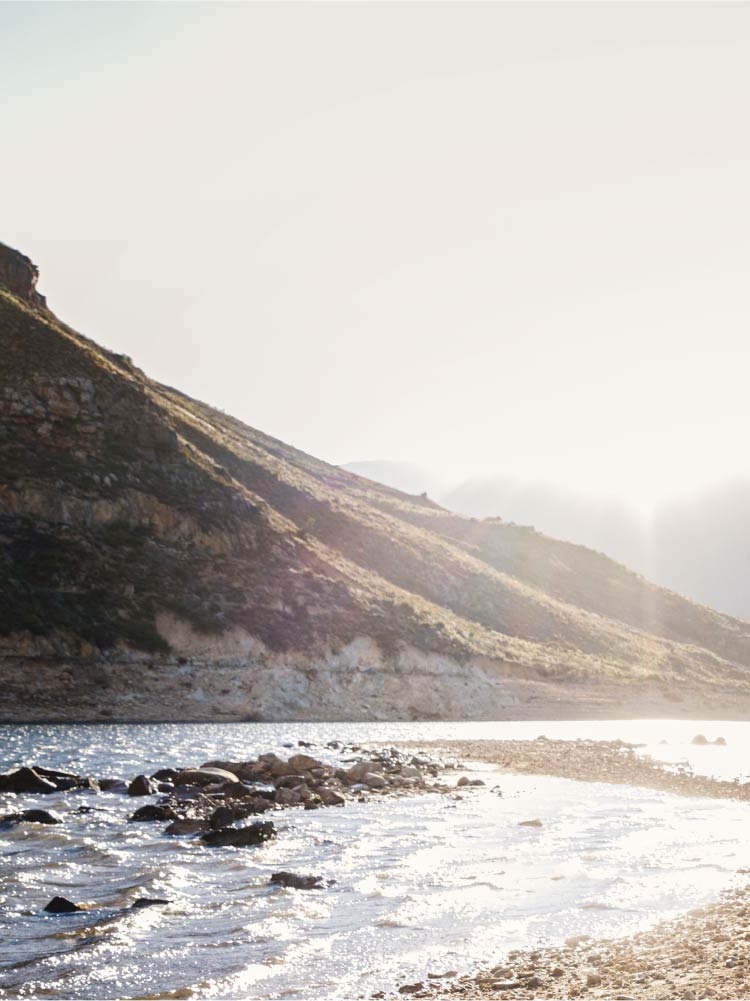 Mountain range beside a body of water