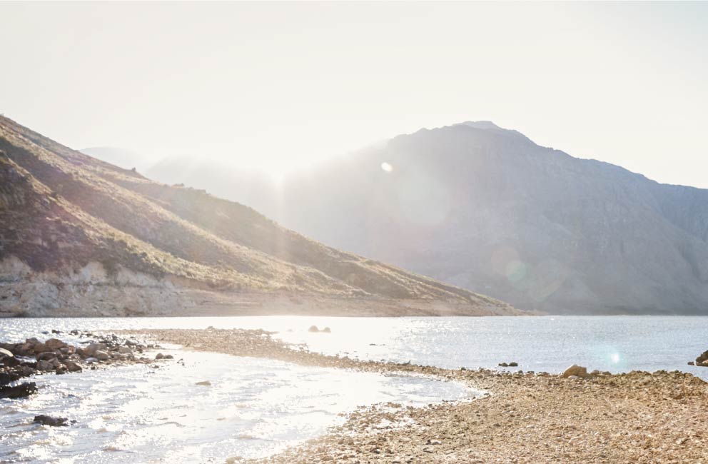 Mountain range beside a body of water