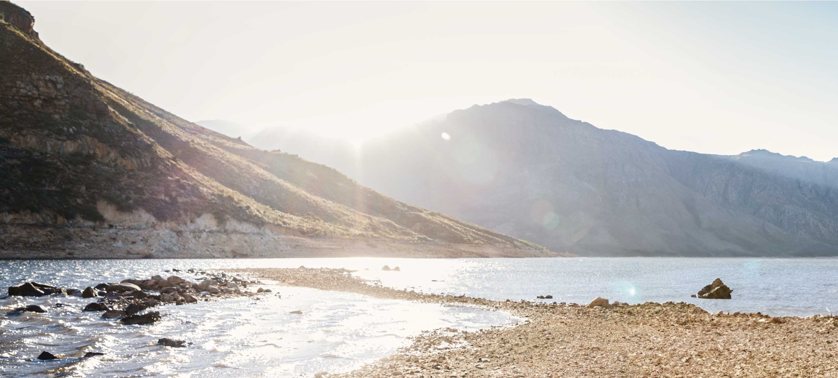 Mountain range beside a body of water